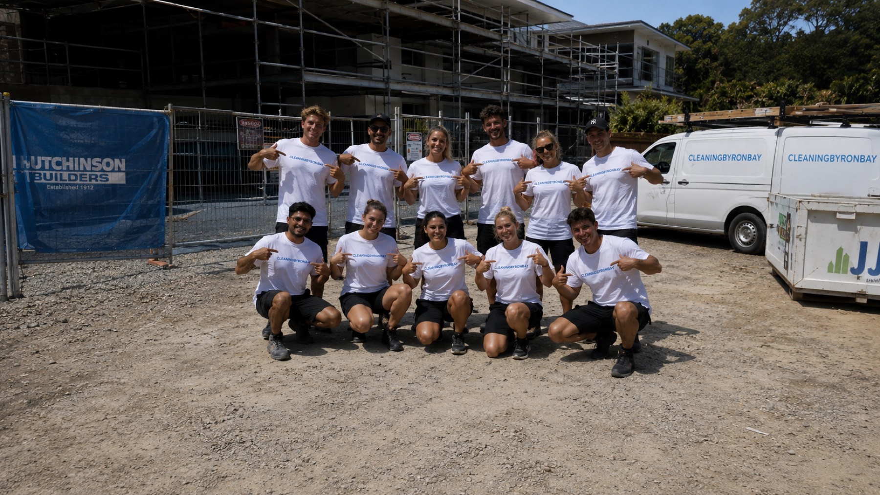 The Cleaning Byron Bay team in branded shirts at a Byron Bay site, with their work van
